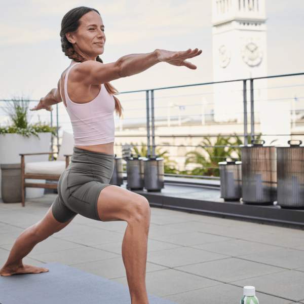 Person doing yoga on the rooftop