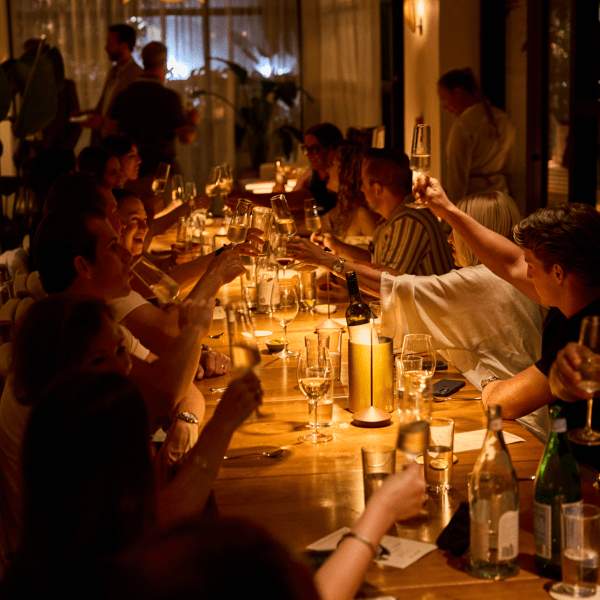 Private dinner with guests sitting around the table