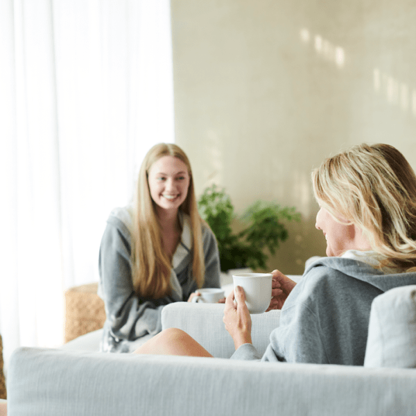 Two people having coffee and talking