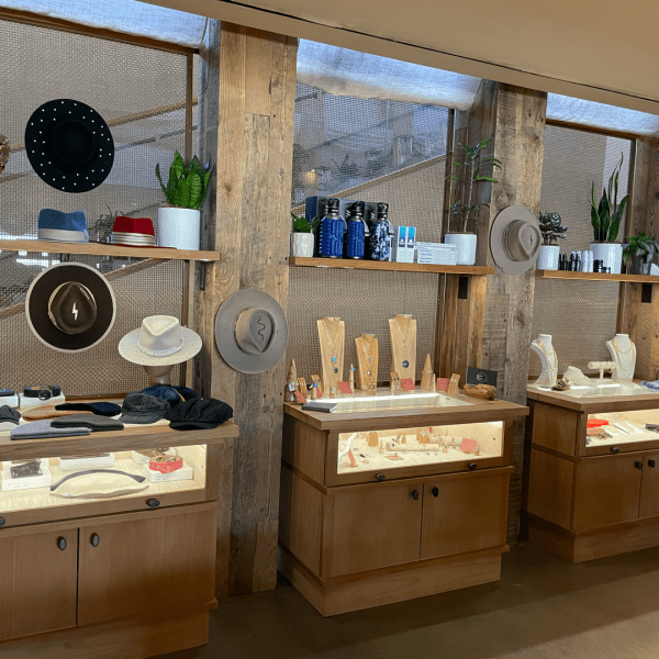 Displays at a store with hats and jewelry 