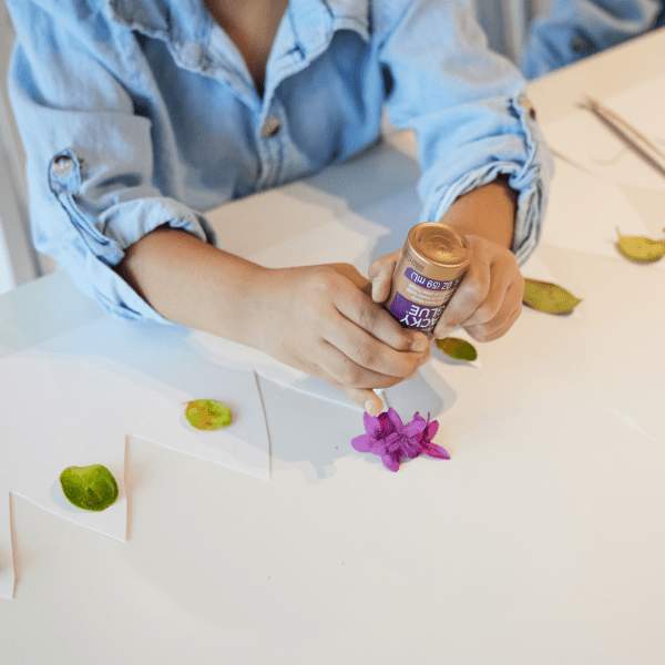 Person using a tube of glue