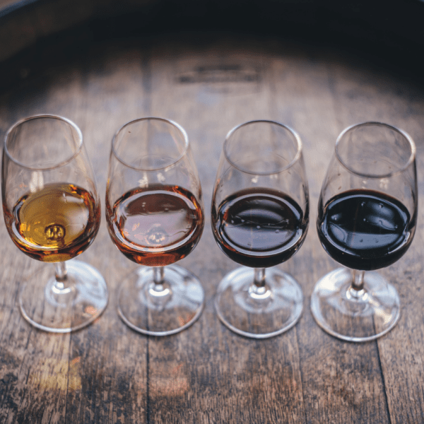 Four glasses lined up in a row