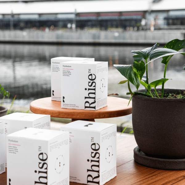 Rhise Hydration Product on a stand 