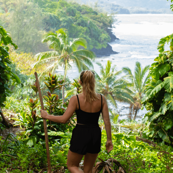 Person hiking along a jungle trail