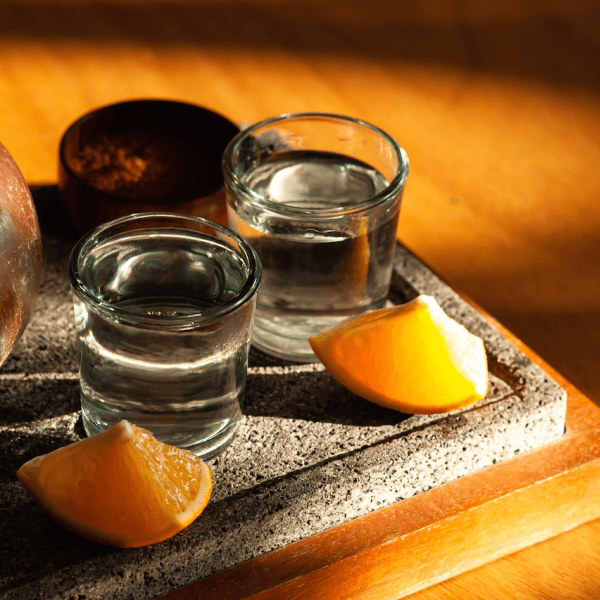 Two glasses of water with an orange slice