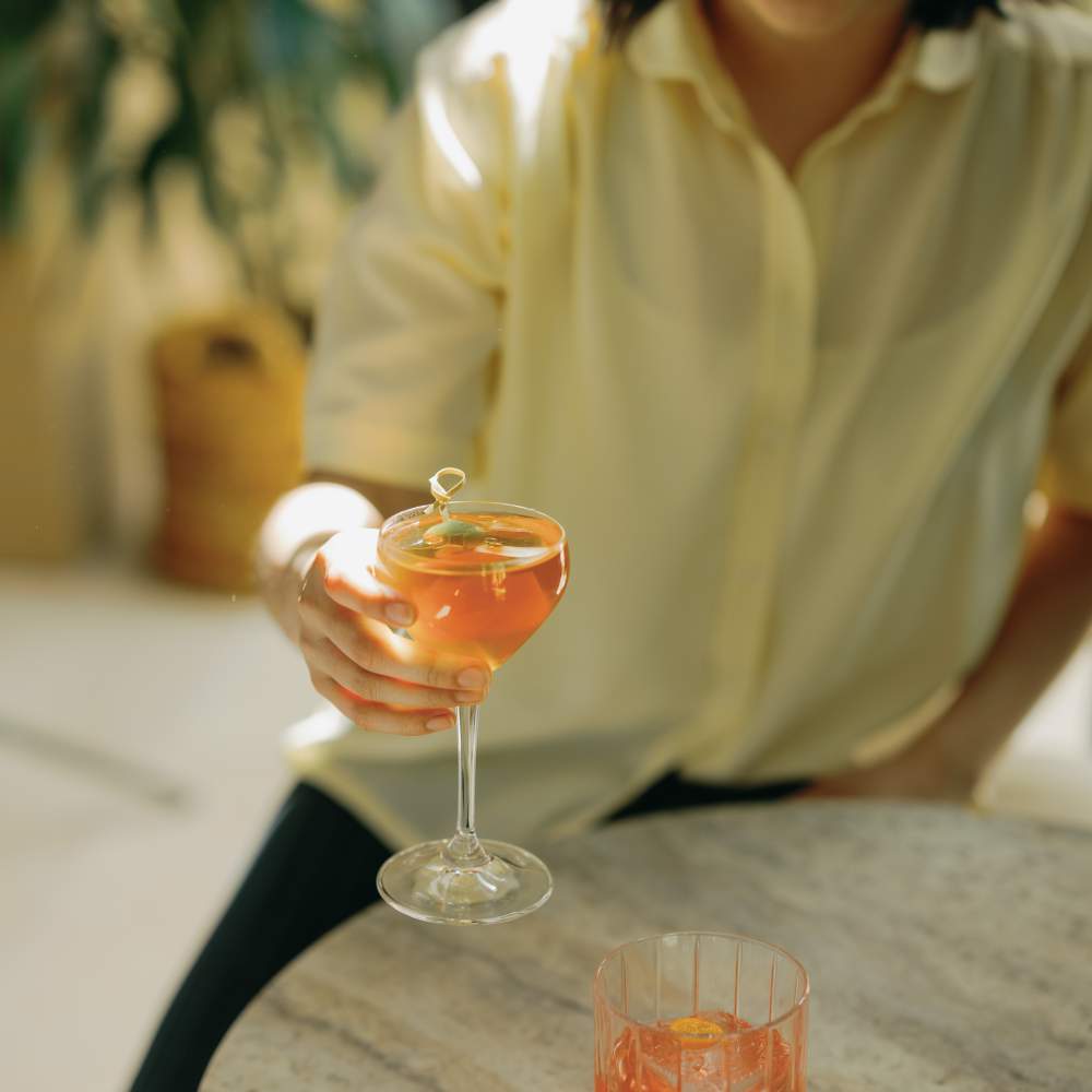 girl drinking a cocktail