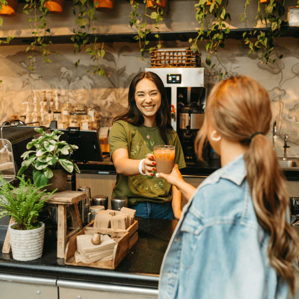 a person buying a beverage