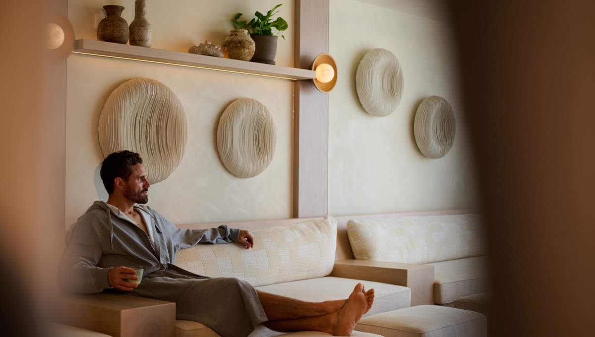 A man sitting on a couch at Bamford Spa