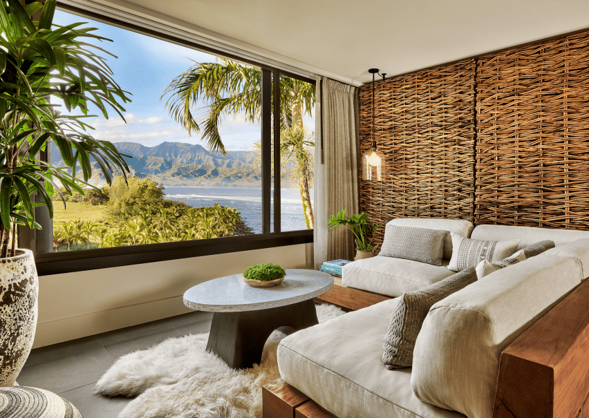 a room with large windows and a beach-view