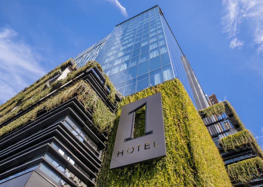 Looking up at 1 Hotel Nashville covered in plants