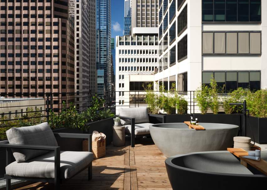 Rooftop spa terrace with stone tubs