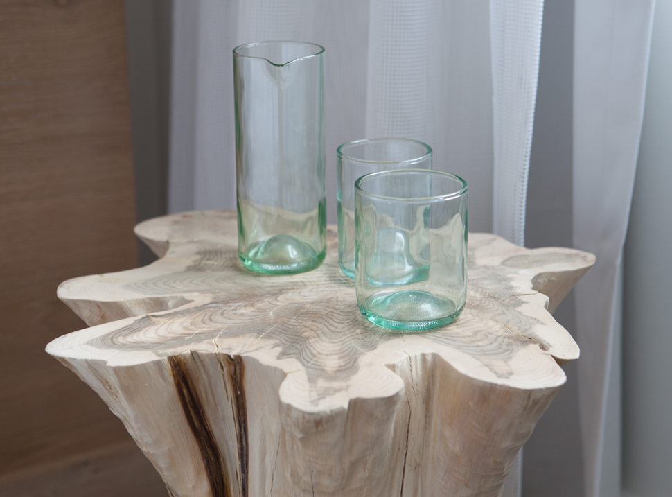 3 glasses sitting on a wood table