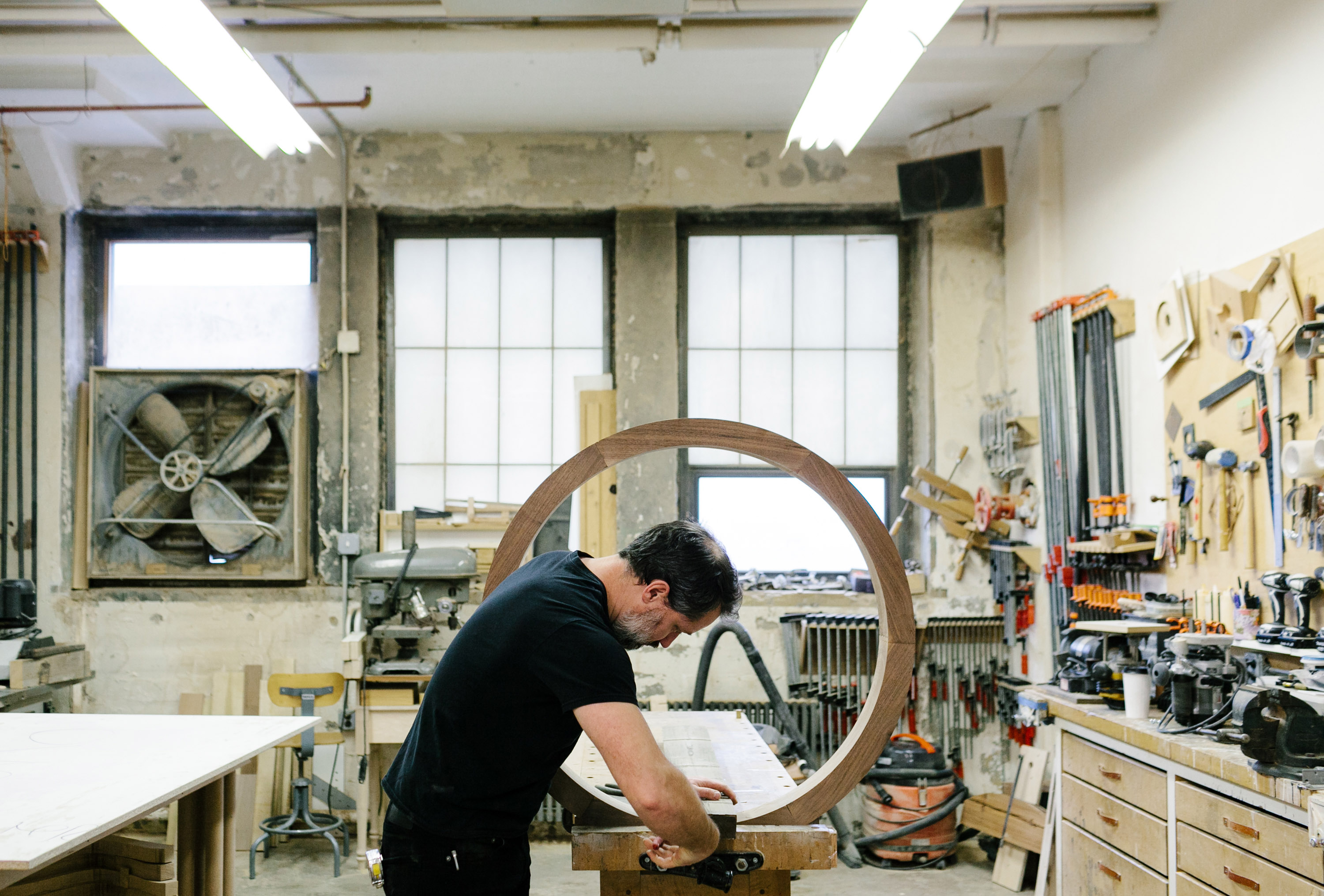 Bien Hecho crafting wood in a workshop