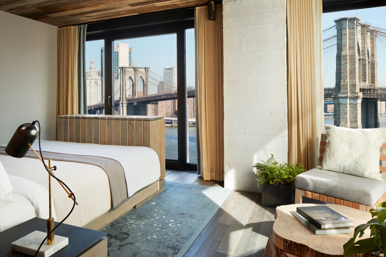 The interior of a hotel suite with a view at 1 Hotel Brooklyn Bridge