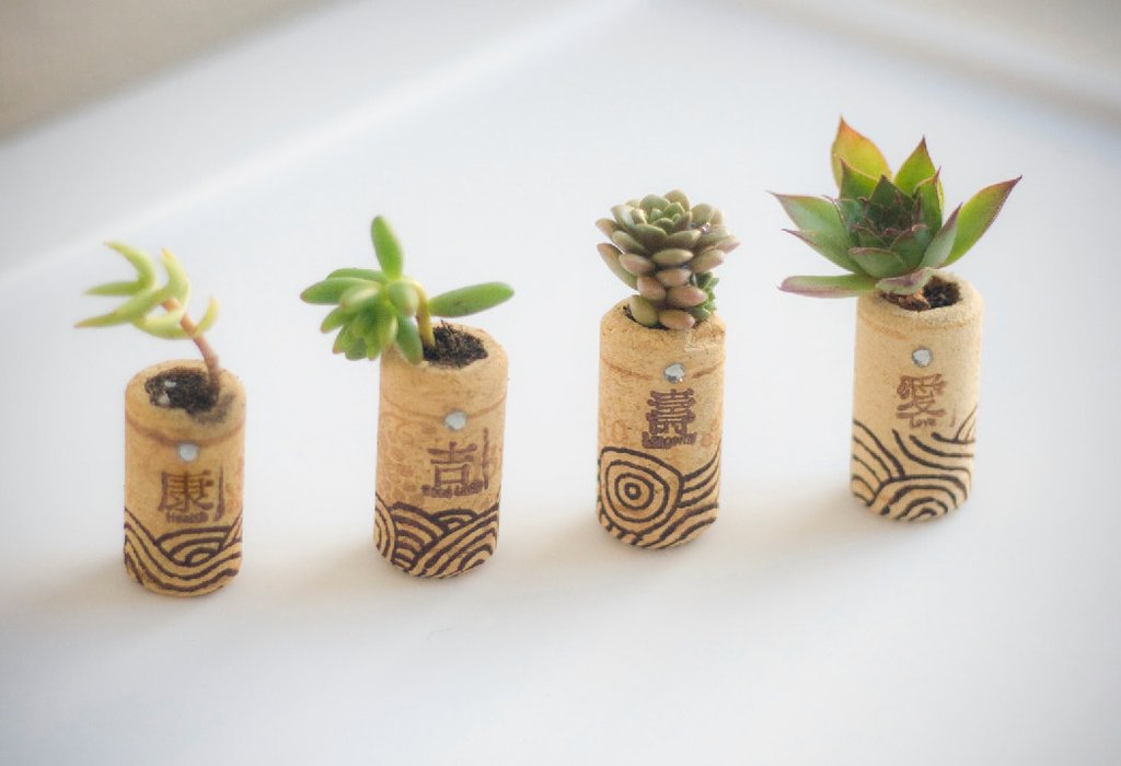 4 corks turned into tiny planters