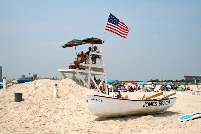 A small boat by a lifeguard station on Jones Beach