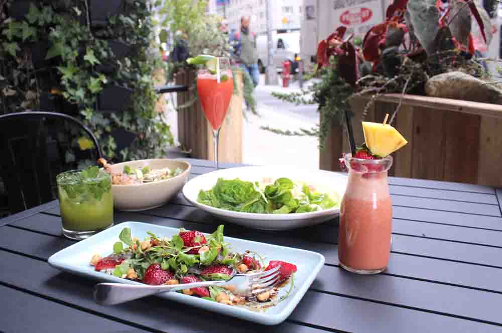 A table served with salads and cocktails