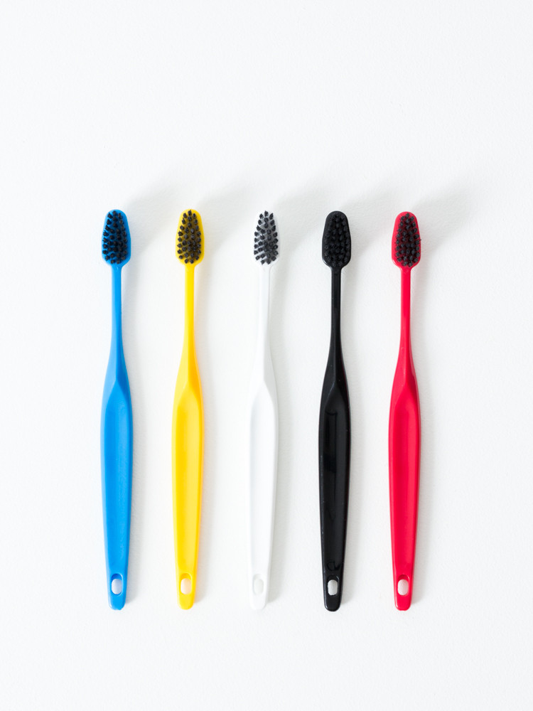 A row of colorful toothbrushes