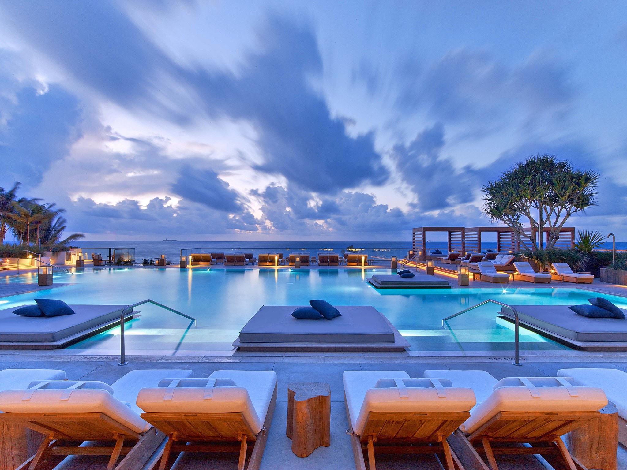 The pool at 1 Hotel South Beach at sunset