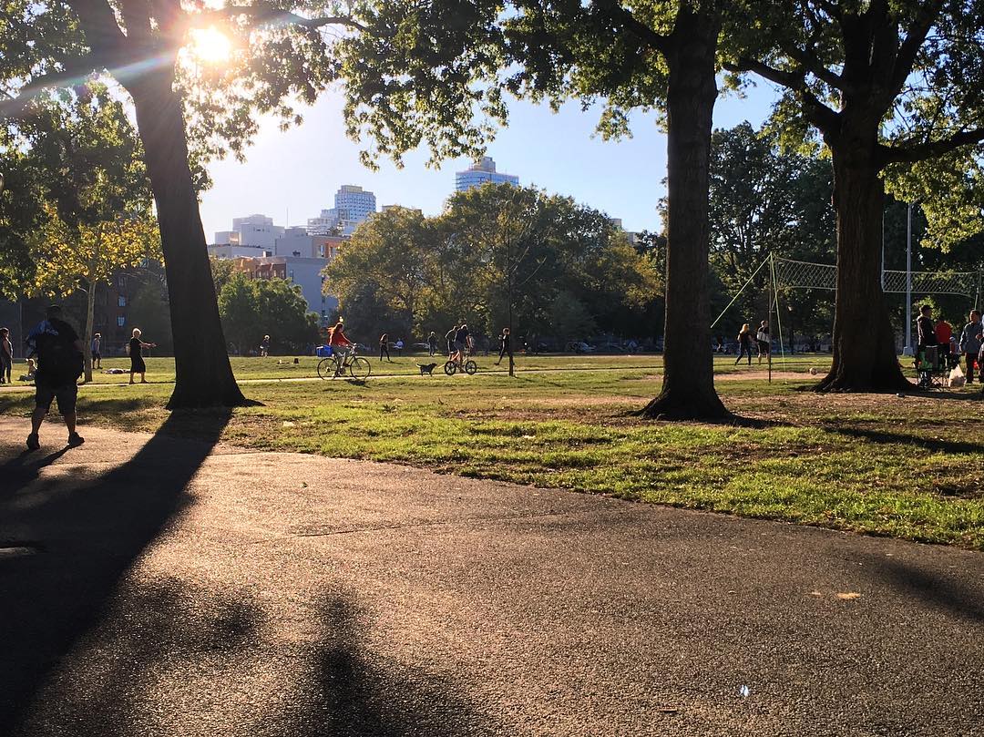 People in Mccarren Park on a sunny day.