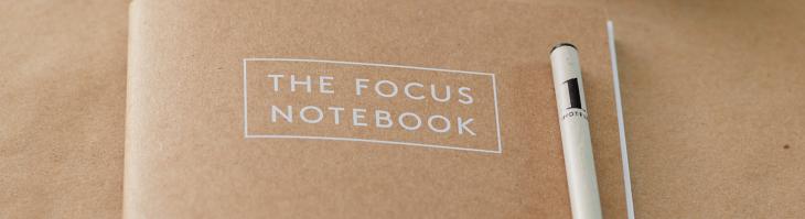 Close up of a notebook labeled "The Focus Notebook"