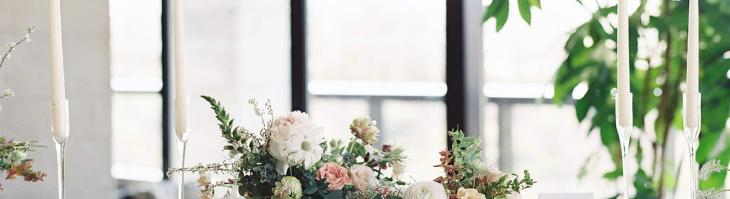 white and pink flower arrangements on a wooden table