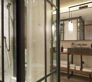 central park suite bathroom with stand up shower and vanity
