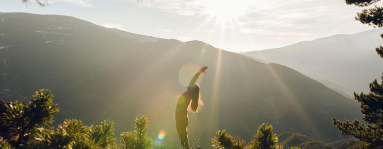 woman in nature doing yoga