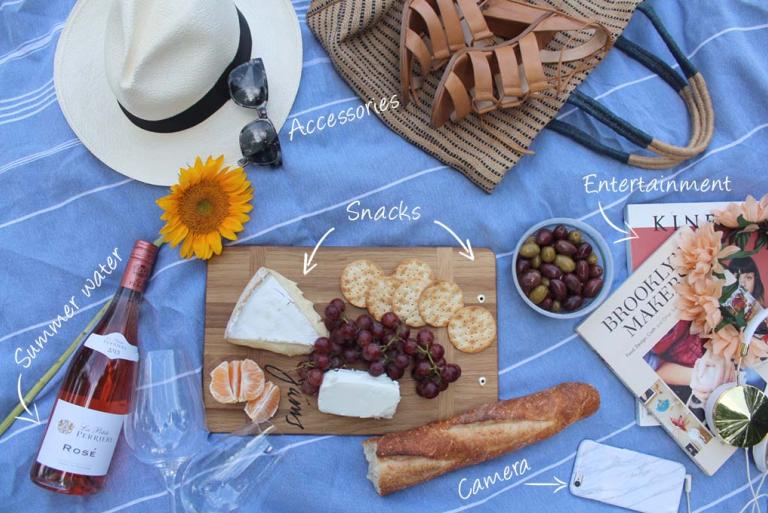 Picnic essentials - wine, cheese, fruit, and a blanket
