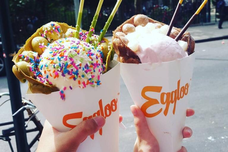 Ice cream cones loaded with candy, sprinkles, and waffles
