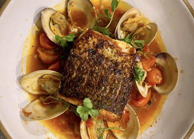 Striped Bass with Spicy Tomato Broth, Toasted Fregola & Local Clams
